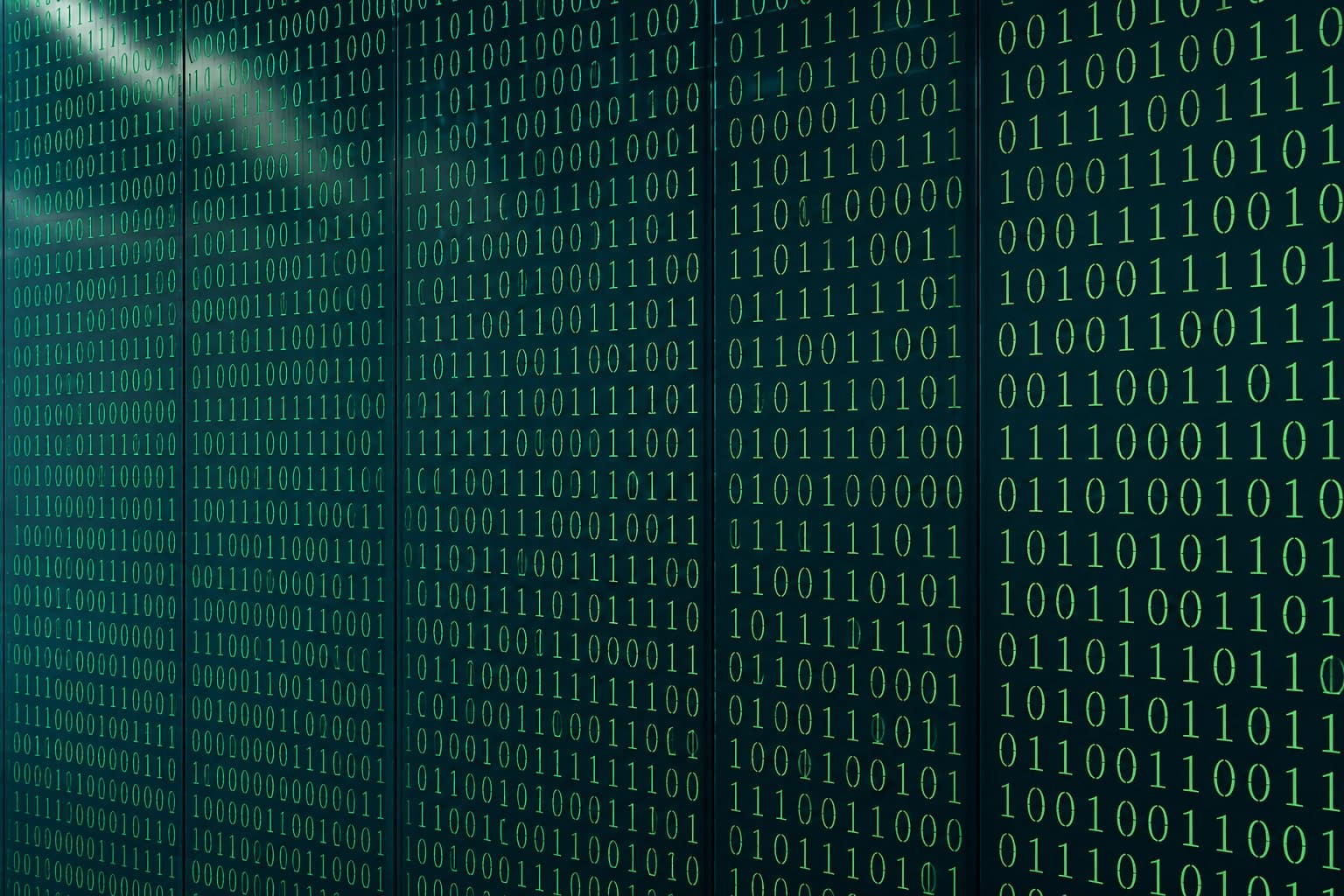 Columns of green binary code on a dark screen